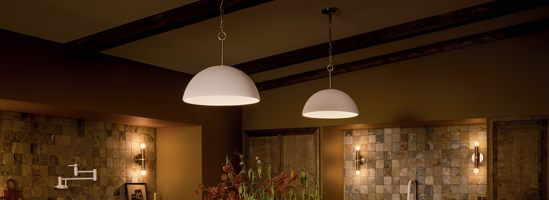 Modern kitchen with warm pendant lighting